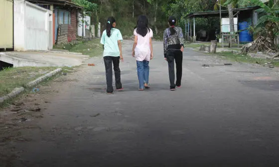 Girls walking on a road in East Malaysia