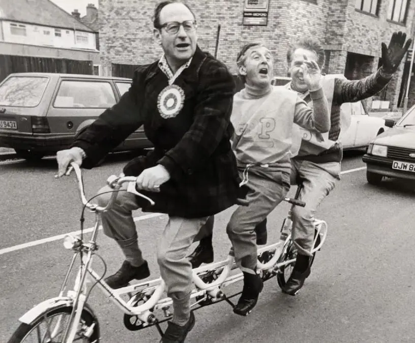 Three men on a tandem