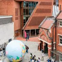Globe statue and corner of Saw Swee Hock building