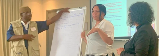 People presenting infront of a room.