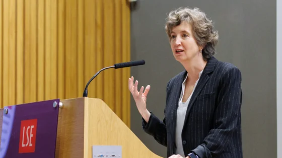 woman speaking at a lecturn