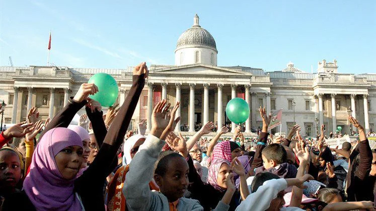 Crowd of people celebrating Eid in Trafalgar Square, London.