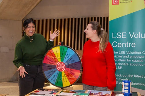 Two members of the Volunteer Centre's staff at a stall