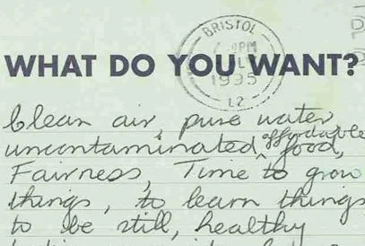 The back of a postcard with a stamp and writing.