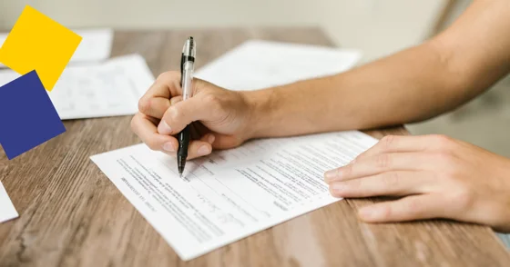 A person completes a written form