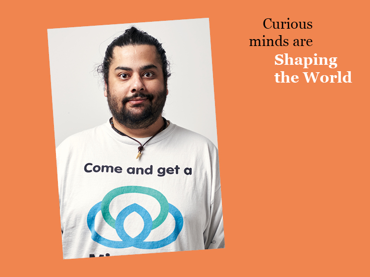 Orange graphic with a profile image of Chitraj Raj Singh and the text "Curious minds are shaping the world"
