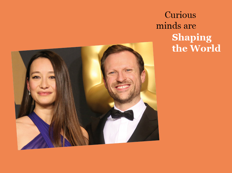 Orange graphic featuring an image of Orlando von Einsiedel and Joanna Natasegara with the text "Curious minds are shaping the world"