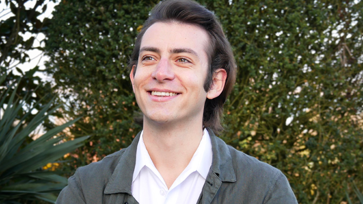 Fabio Richter is photographed smiling against a backdrop of trees