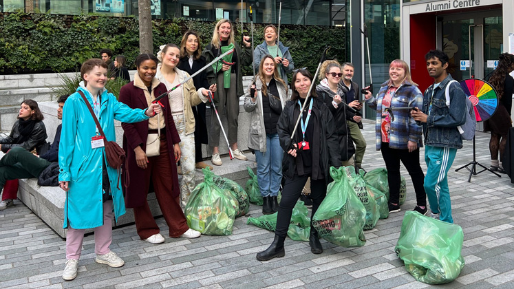 LSE alumni and staff pose for a group photo after a litter pick in Lincoln's Inn Fields