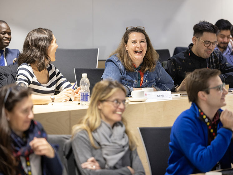 Students enjoying an EMSc lecture, with lots of smiley faces