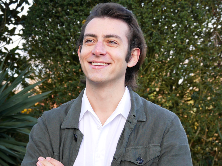 Fabio Richter is photographed smiling against a backdrop of trees