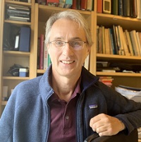 Profile image of Mike Ferguson in front of a bookcase