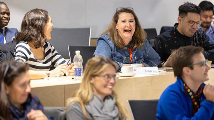 A lady laughs during a class at LSE