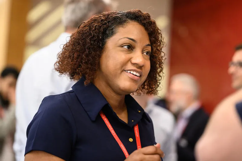 Female executive in conversation with another executive Supply Chain Leadership