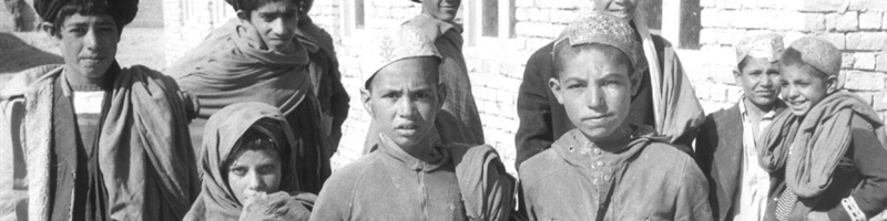 A balck and white photo of a group of boys and young men