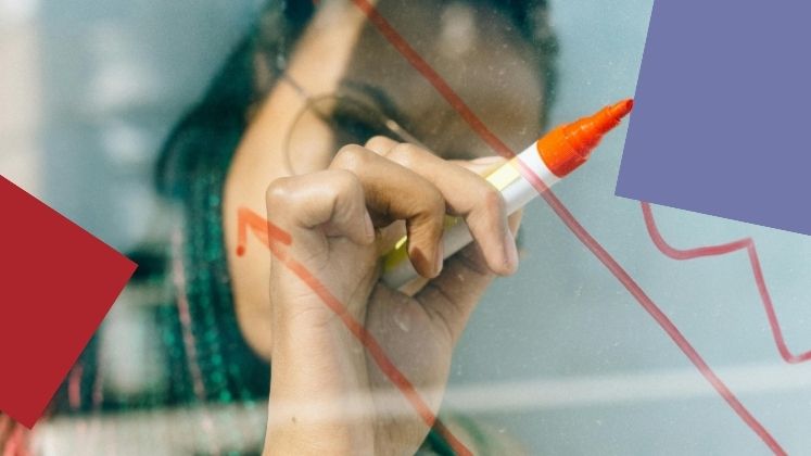 Woman writing on a whiteboard