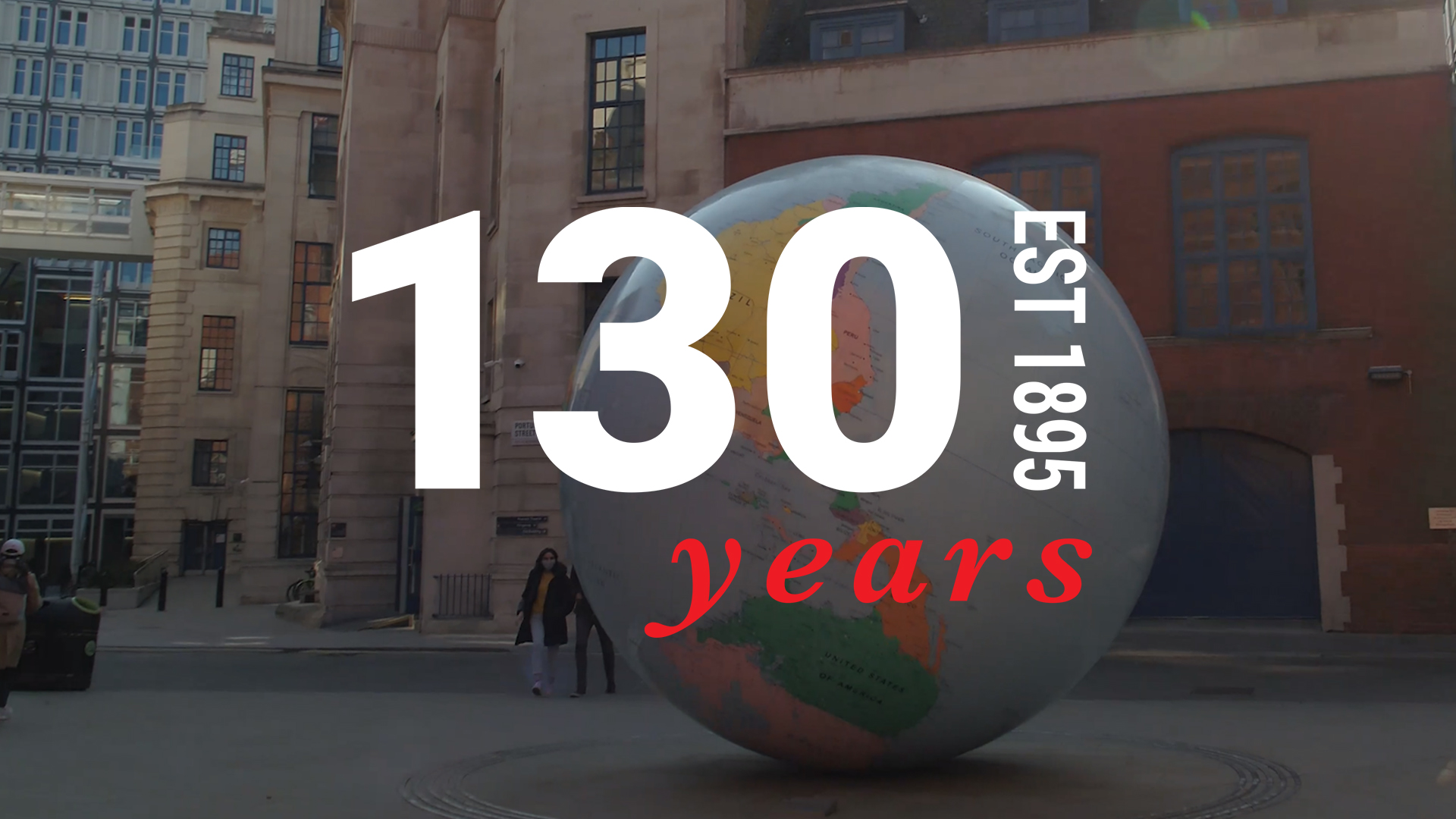 The LSE 130 logo with an image of LSE's Globe sculpture behind it.