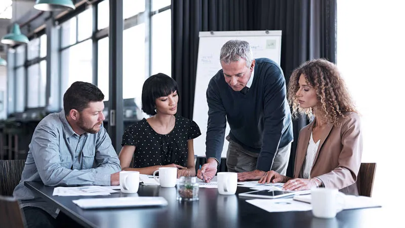 Professionals working in a group in the office Risk and Crisis Management