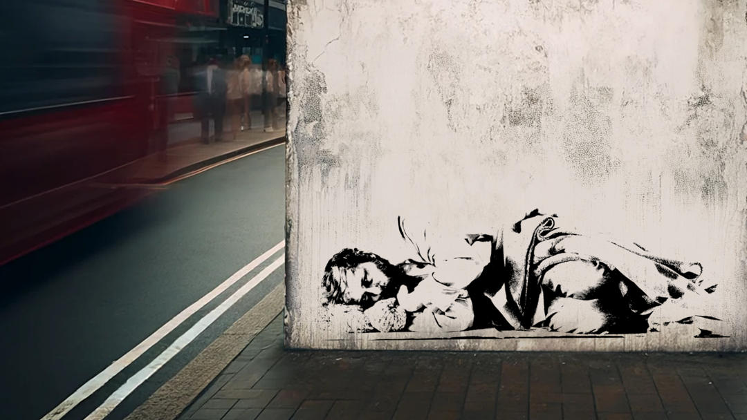 A Banksy-style illustration of a homeless person on a wall in London