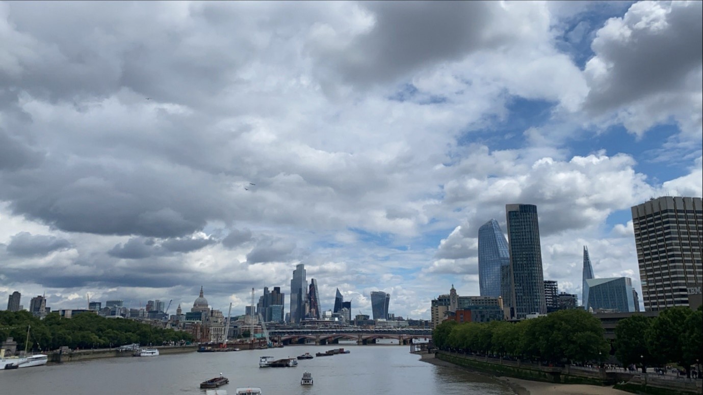 An image of the London skyline with a cloudy sky.