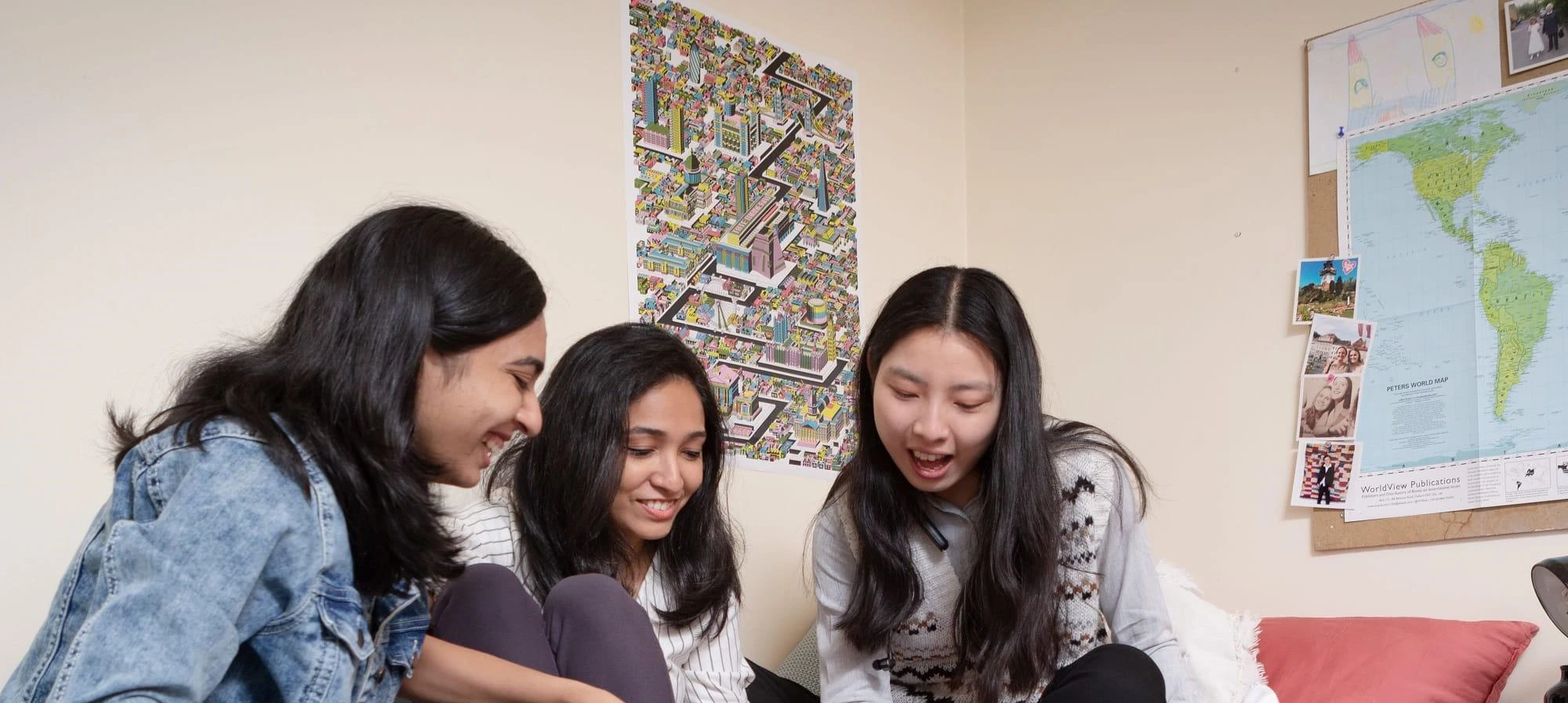 3 girls sitting on bed