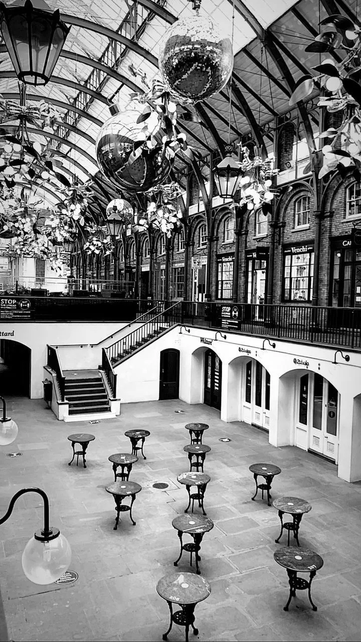 A black and white photo of an empty hall